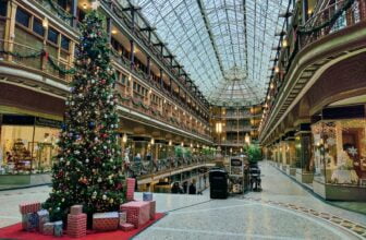 state of the art building interior with lit Christmas tree