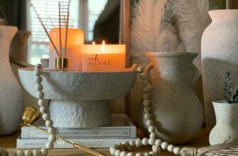 white pillar candles on gray steel candle holder