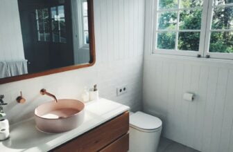 white ceramic sink with stainless steel faucet